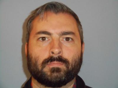 Justin Menoche a registered  of Texas