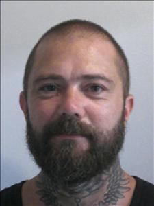 Justin Michael Sneed a registered Sex, Violent, or Drug Offender of Kansas