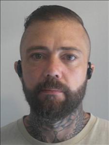 Justin Michael Sneed a registered Sex, Violent, or Drug Offender of Kansas